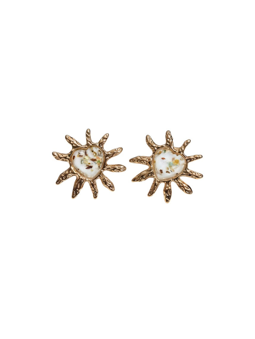 Yanet Collective heart-shaped stud earrings in beige with gold sunburst frames and textured metallic finish
