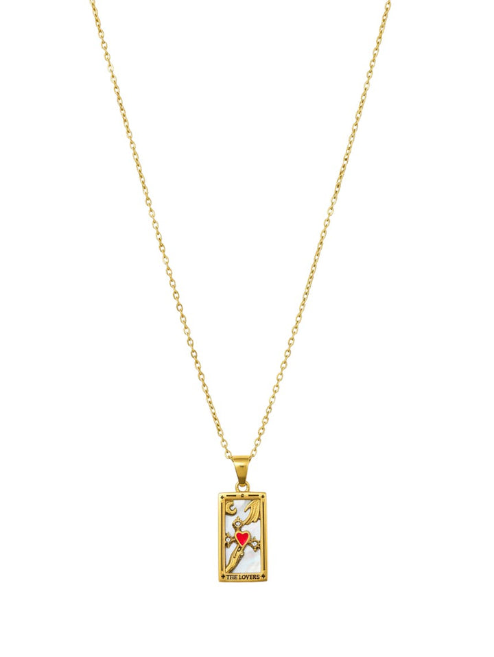 Yanet Collective The Lovers tarot card pendant necklace in gold with a mother of pearl inlay and red heart detail.